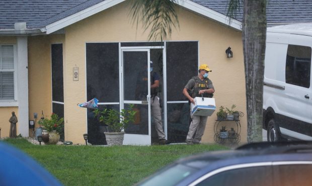 NORTH PORT, FL - SEPTEMBER 20: FBI agents begin to take away evidence from the family home of Brian...