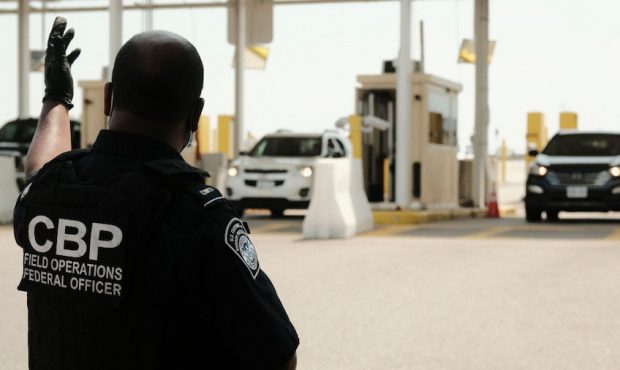 U.S. Customs and Border Protection agents direct vehicles re-entering the U.S. from Canada, which h...