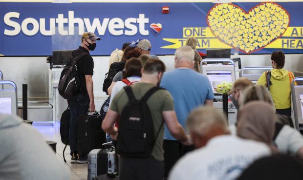 Travelers check in at the Southwest Airlines ticketing counter at Baltimore Washington Internationa...
