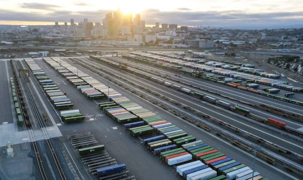 In an aerial view, shipping containers sit in a rail yard on October 22, 2021 in Los Angeles, Calif...