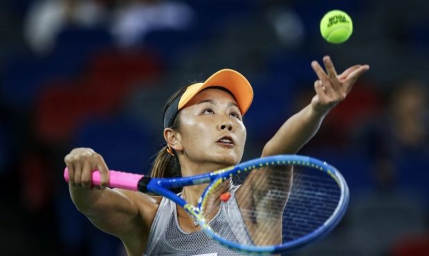 WUHAN, CHINA - SEPTEMBER 23: Shuai Peng of China severs a shot during the match against Garbine Mug...