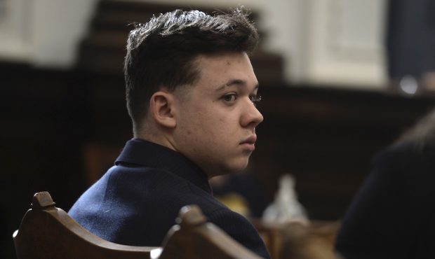 Kyle Rittenhouse listens as his lawyer gives opening statements to the jury at the Kenosha County C...