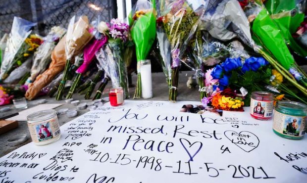 Candles, flowers and letters are placed at a memorial outside of the canceled Astroworld festival a...