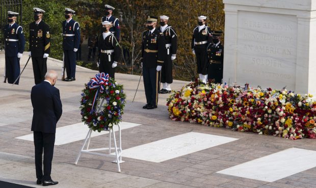 President Joe Biden pauses after placing a wreath during a centennial ceremony for the Tomb of the ...