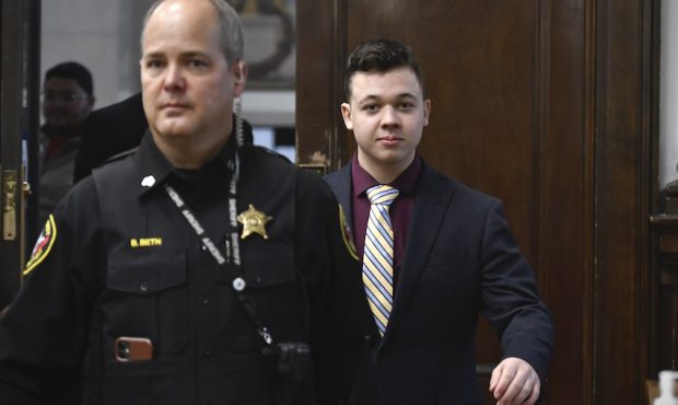 Kyle Rittenhouse walks back into the courtroom after a break during his trial at the Kenosha County...