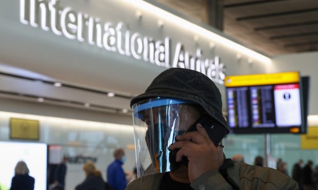 A man wears a face covering at Heathrow Terminal 2 on Nov. 28, 2021, in London, England. Following ...
