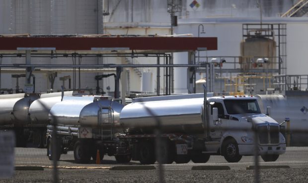 FILE: A fuel truck leaves a fuel terminal after filling its tanks with gas on April 29, 2021 in Ric...