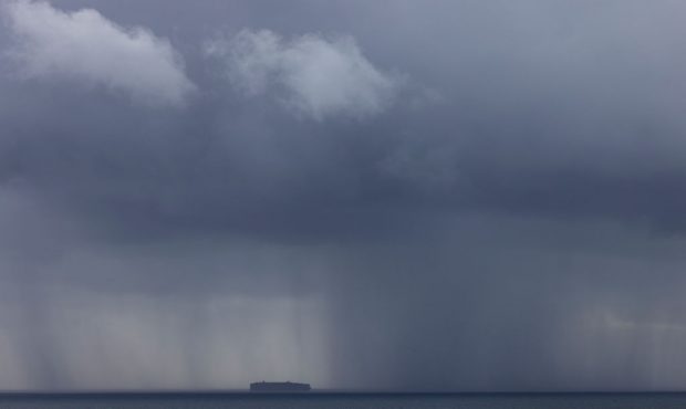 FILE -- DOVER, ENGLAND - NOVEMBER 01: A ship carrying freight moves through a rain storm in the Eng...