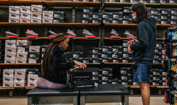 An Under Armour employee assists a customer on November 03, 2021 in Houston, Texas. Under Armour ha...