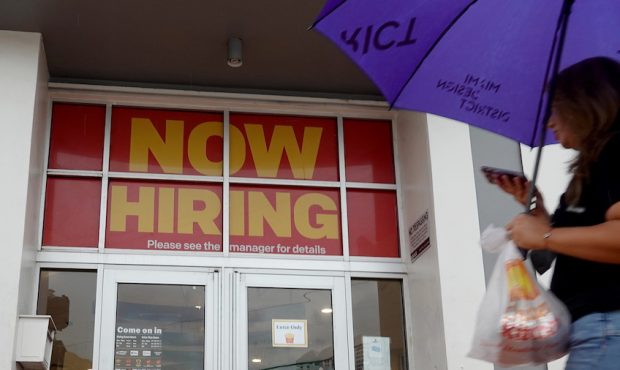 A ''Now Hiring" sign hangs above the entrance to a McDonald's restaurant on November 05, 2021 in Mi...