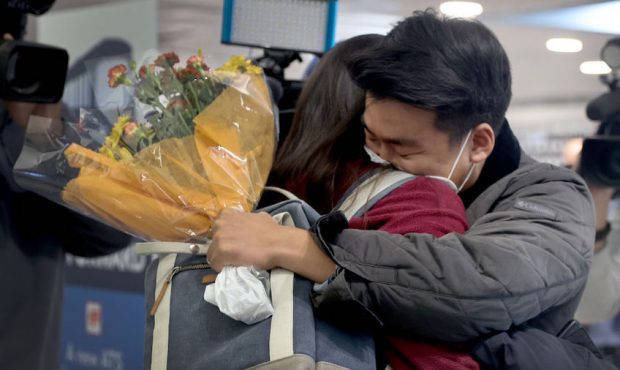 Yerin Hong gets a hug from her boyfriend Soomin Kim after she arrived on a flight from Germany at t...