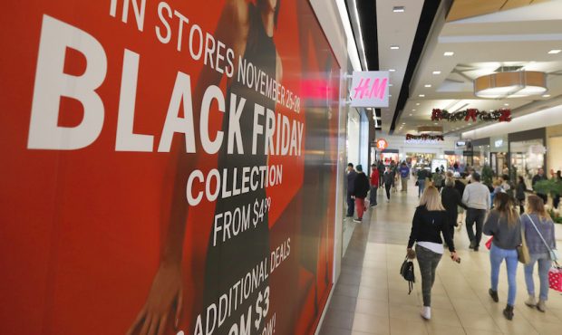FILE: Shoppers walk through the Fashion Place Mall looking for 'Black Friday" deals on Nov. 25, 201...