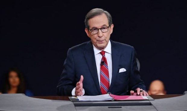 Debate moderator and Fox News anchor Chris Wallace directs the first presidential debate between U....