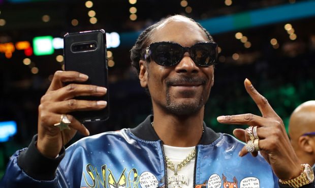 BOSTON, MASSACHUSETTS - JANUARY 20: Rapper Snoop Dogg courtside before the game between the Boston ...