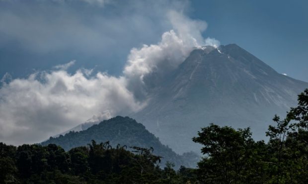 YOGYAKARTA, INDONESIA - AUGUST 17: Mount Merapi spews volcanic material during a ceremony to mark t...