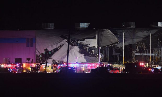 First responders surround a damaged Amazon Distribution Center on December 10, 2021 in Edwardsville...