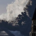 LA PALMA, SPAIN - NOVEMBER 12: The Cumbre Vieja volcano continues to erupt above a church spire in the town of El Paso on November 12, 2021 in La Palma, Spain. The volcano has been erupting since September 19, 2021 after weeks of seismic activity, resulting in millions of Euros worth of damage to properties and businesses, as the lava flowed down the mountainside towards the sea. (Photo by Dan Kitwood/Getty Images)