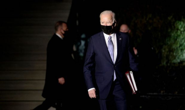 U.S. President Joe Biden walks towards reporters to speak with them before boarding Marine One on t...