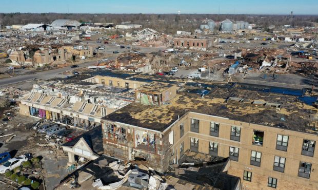 In this aerial view, homes and businesses are reduced to rubble after a tornado ripped through the ...