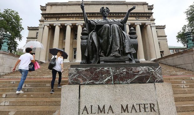 FILE: People walk past the Alma Mater statue on the Columbia University campus on July 1, 2013 in N...