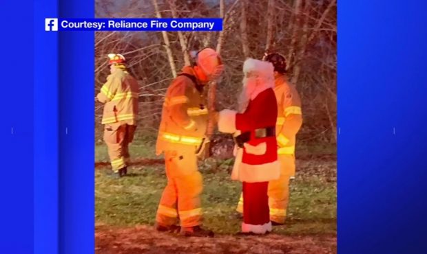 Santa Clause chats with members of the Reliance Fire Company on December 18. Santa was riding in a ...