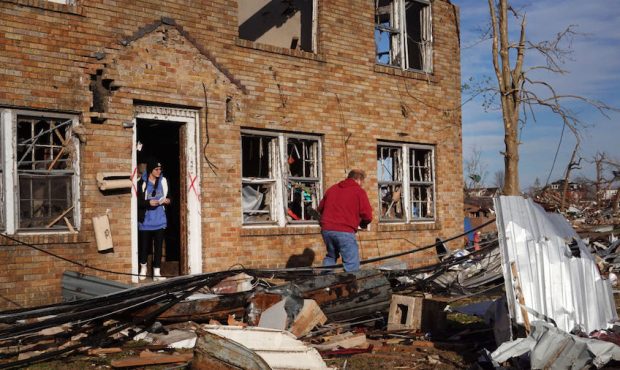 Residents begin the process of salvaging their belongings after a tornado ripped through the area t...