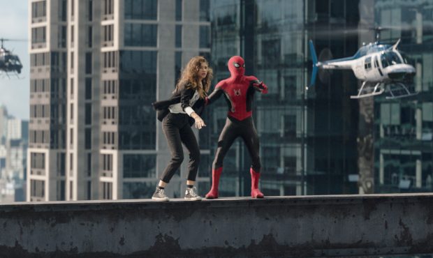 Spider-Man holds on to MJ (Zendaya) in Columbia Pictures' SPIDER-MAN: NO WAY HOME....