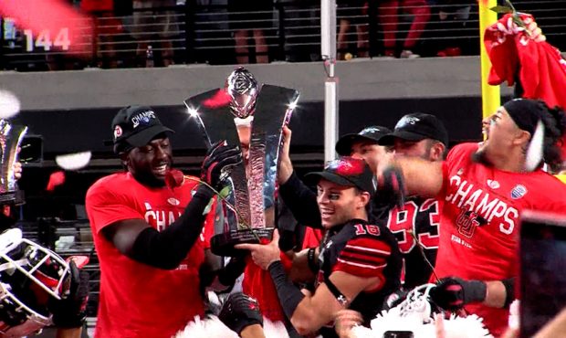 The Utah Utes celebrate after winning the PAC 12 Championship Saturday night. The Utes will play Oh...