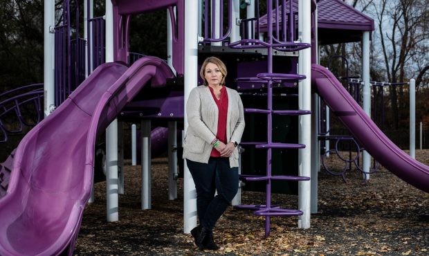 Nicole Hockley poses for a portrait at a playground dedicated to her son Dylan, a Sandy Hook victim...