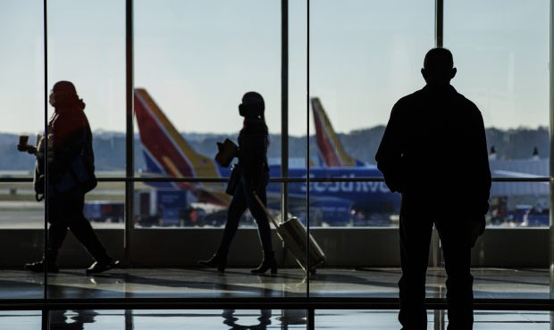 Travelers walk through the concourse at BaltimoreWashington Airport (BWI) in Baltimore, Maryland, U...