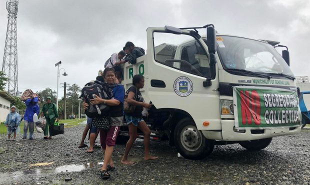 Evacuees arrive at the Siargao Sports Complex in Dapa town, Siargao island, Surigao del Norte provi...