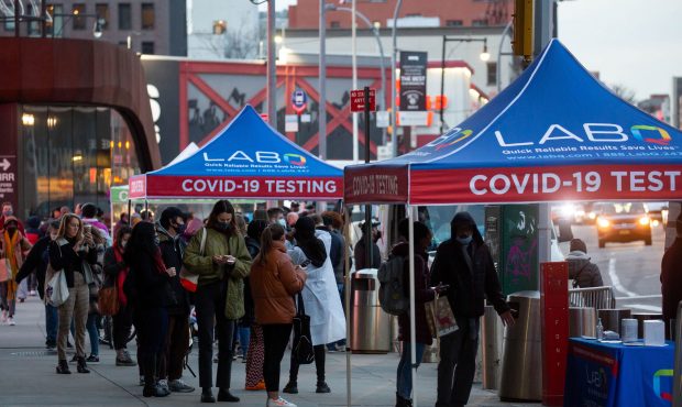 People wait in line for COVID-19 tests in the Brooklyn borough of New York, the United States, Dec....
