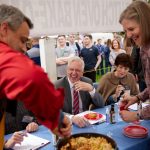 Elder D. Todd Christofferson of the Quorum of the Twelve Apostles judges a Dutch-oven cookoff at the Old Town San Diego State Historic Park in San Diego, California, on Saturday, January 29, 2022. (Intellectual Reserve, Inc.)