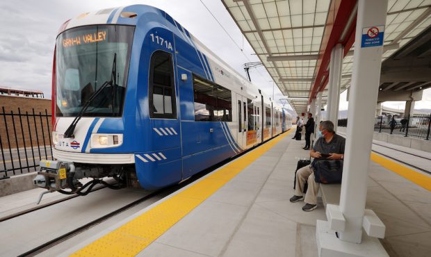 Officials gather to celebrate the Utah Transit Authority's new TRAX airport station, marking the cu...