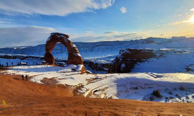 World famous delicate arch in red rock covered by snow...
