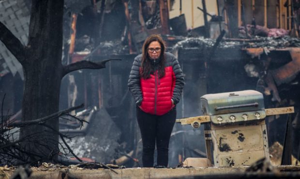 LOUISVILLE, CO - DECEMBER 31: Laurie Silver of Lafayette, Colorado takes in what remains of her cou...