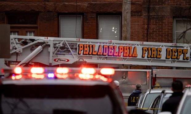 Emergency vehicles are pictured near the scene of the fatal fire in the Fairmount neighborhood on J...