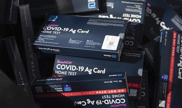COVID-19 at-home rapid test kits are given away during a drive-thru event at the Hollywood library ...