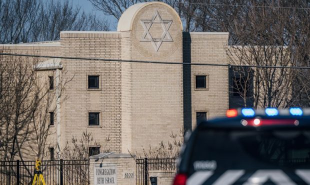 COLLEYVILLE, TEXAS - JANUARY 16: A law enforcement vehicle sits in front of the Congregation Beth I...