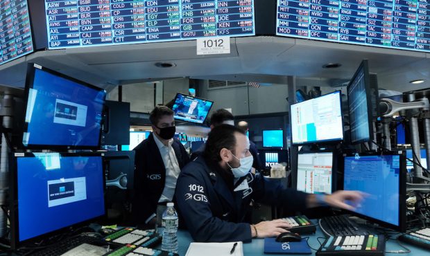 Traders work on the floor of the New York Stock Exchange (NYSE) on January 18, 2022 in New York Cit...