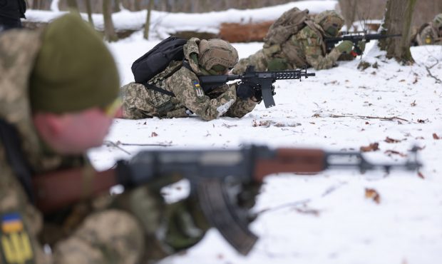 Civilian participants in a Kyiv Territorial Defence unit train on a Saturday in a forest on January...