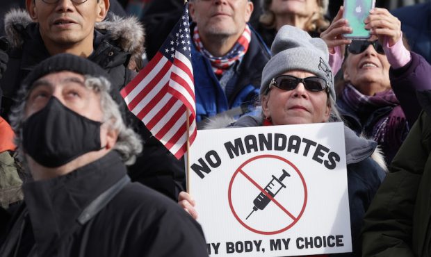 Anti-vaccination activists participate in a rally after a Defeat The Mandates DC march at the Linco...