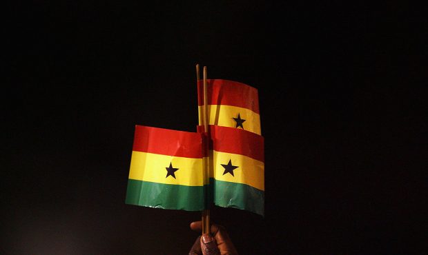 FILE PHOTO: LONDON - MARCH 26:  A Ghana fan holds up Ghanaian flags during the international friend...