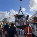 Donated supplies being loaded onto the boat Mauri which is headed to the outer islands of the Ha'apai area which was hard hit by a tsunami on 15 January 2022. Tonga, January 2022. (Intellectual Reserve, Inc.)