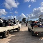 Clothing, food, bedding and other supplies donated by church members from the Tongatapu stakes are loaded into trucks ready to take to the wharf. Tonga, January 2022. (Intellectual Reserve, Inc.)