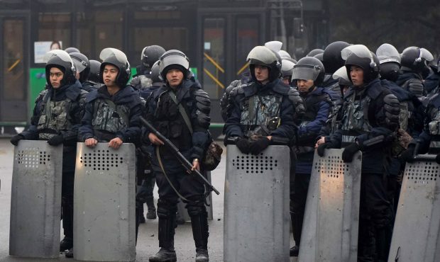 Riot police officers stand by during a protest in Almaty, Kazakhstan, Wednesday, Jan. 5, 2022. Demo...