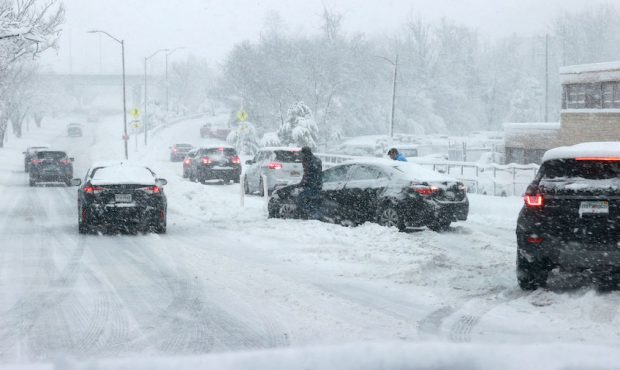 A car became stranded car on the highway in Alexandria, Virginia, as a winter snow storm hit the No...