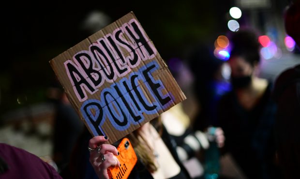 PHILADELPHIA, PA - APRIL 13:  A placard states "ABOLISH POLICE" during a march to protest the death...