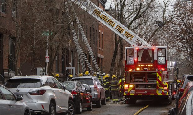 Firefighters work at the scene of a deadly row house fire in Philadelphia. (Alejandro A. Alvarez/Ph...