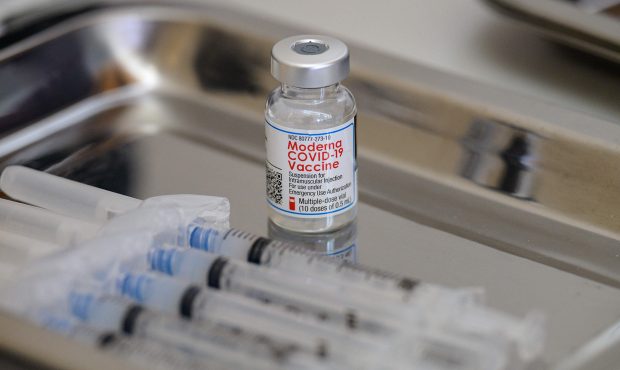 A vial of the Moderna Covid-19 vaccine and syringes sit prepared at a pop up vaccine clinic at the ...